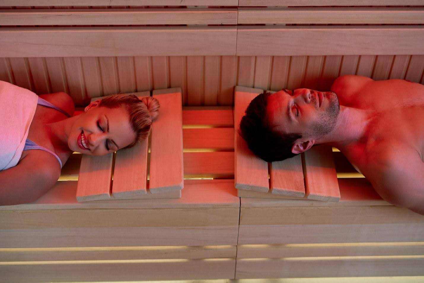 Couple experiencing the Sauna Detox Benefits in a stress-free environment