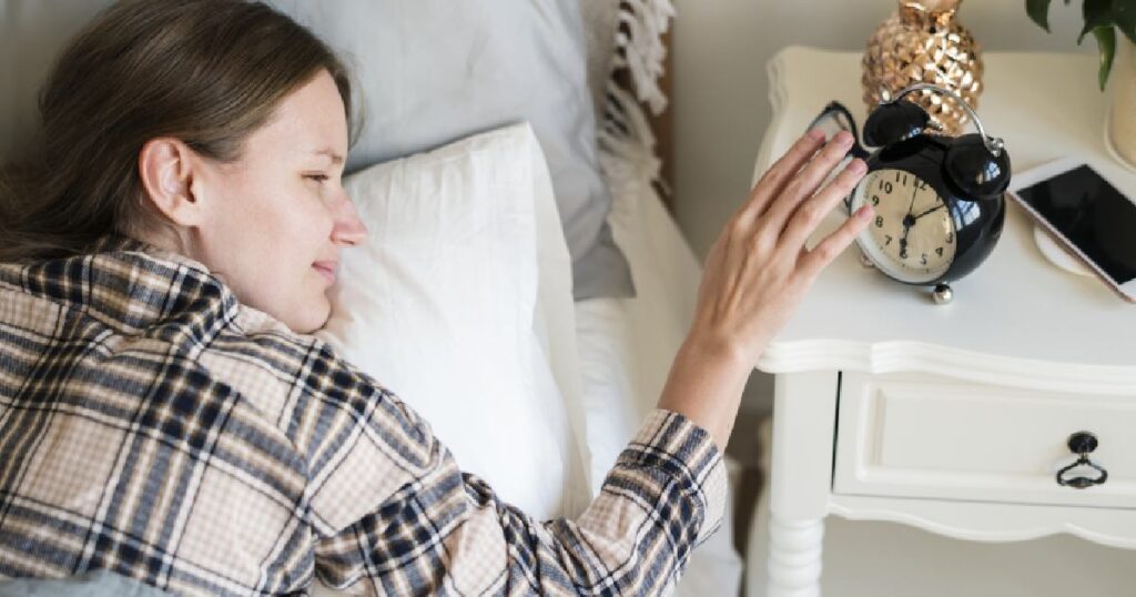 Woman with disrupted circadian rhythm in need of infrared sauna session