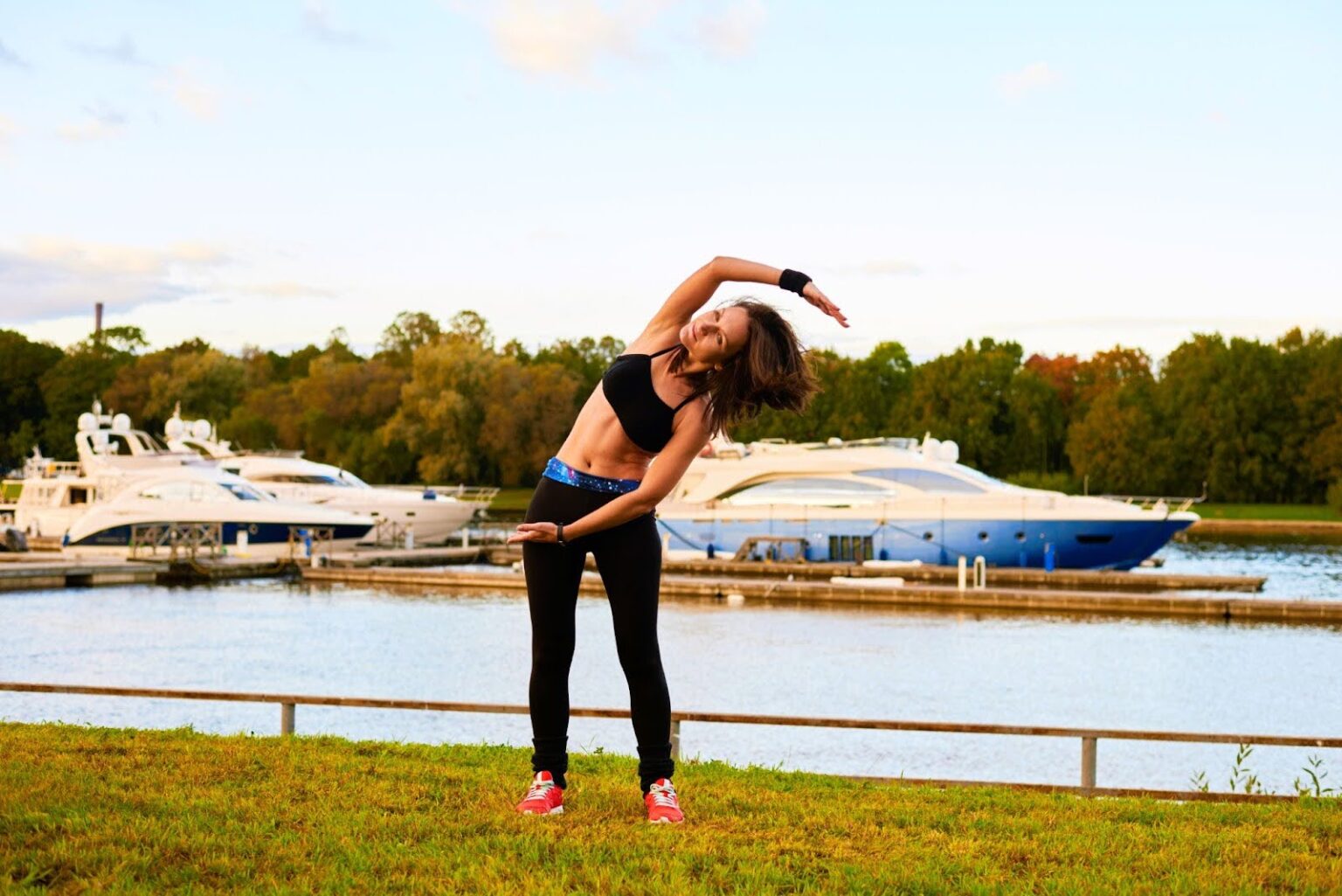 Woman enjoys improved circulation and muscle flexibility after infrared sauna session.
